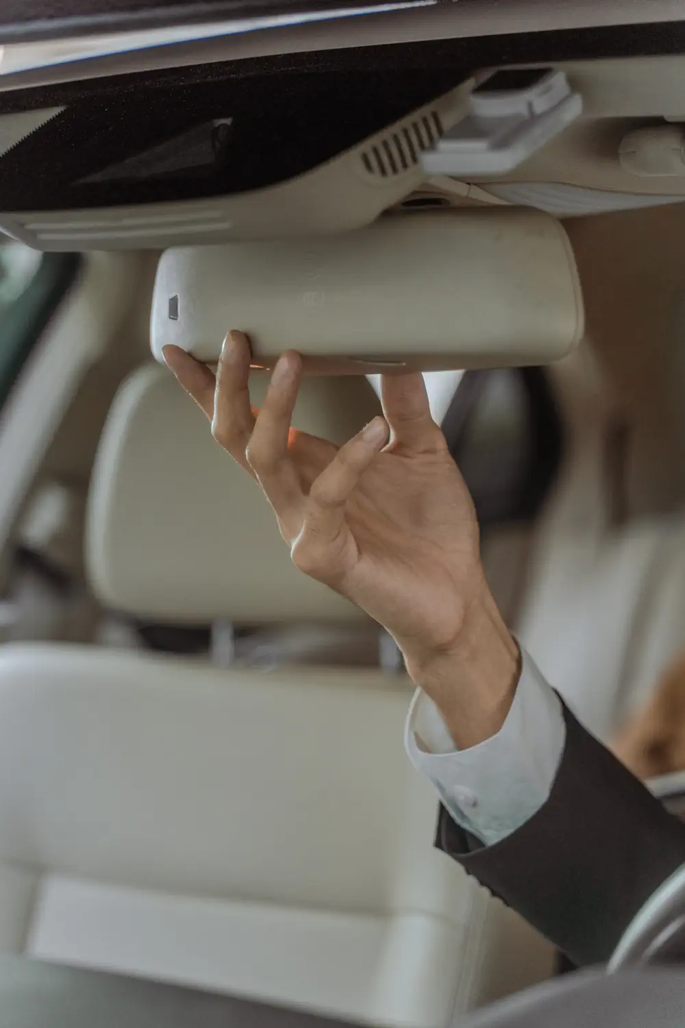 Chauffer adjusting inside mirror